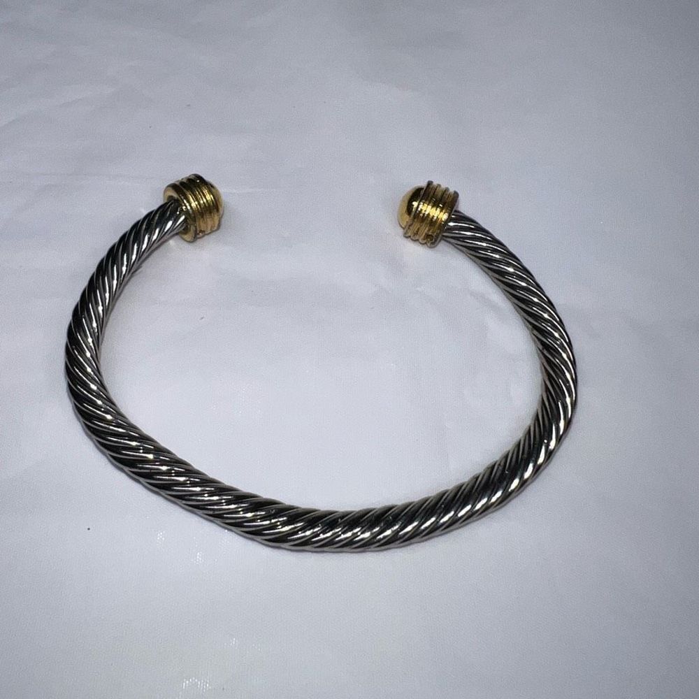 Silver Tone Twisted Cuff Bracelet with Gold Tone Caps